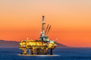 Offshore oil platform at dusk prevent-hazards